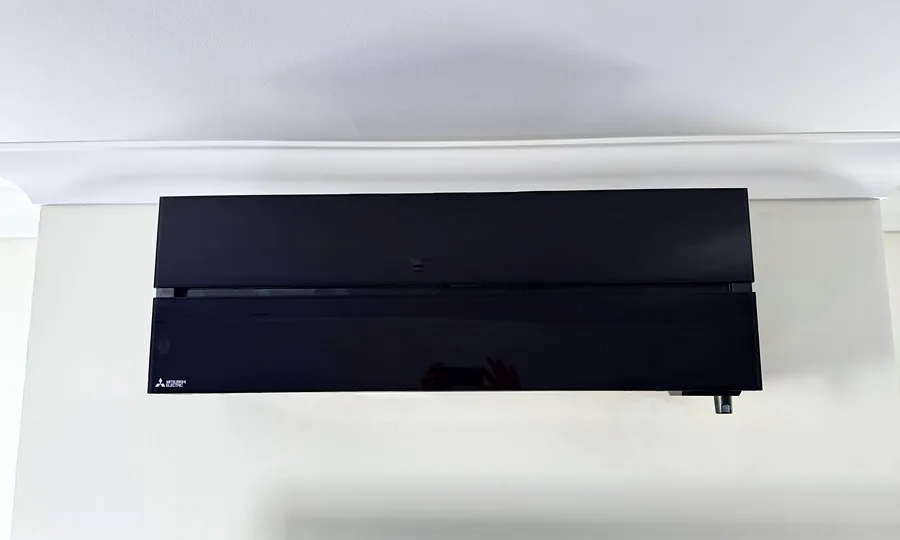 A black Mitsubishi Electric wall unit we installed in a customer's home