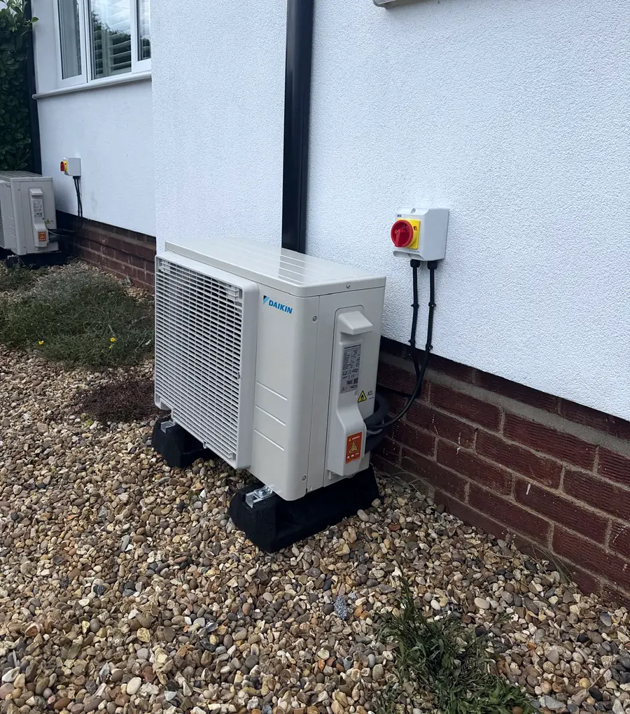A Daikin outdoor unit we fitted with a neat isolator switch on a rendered wall