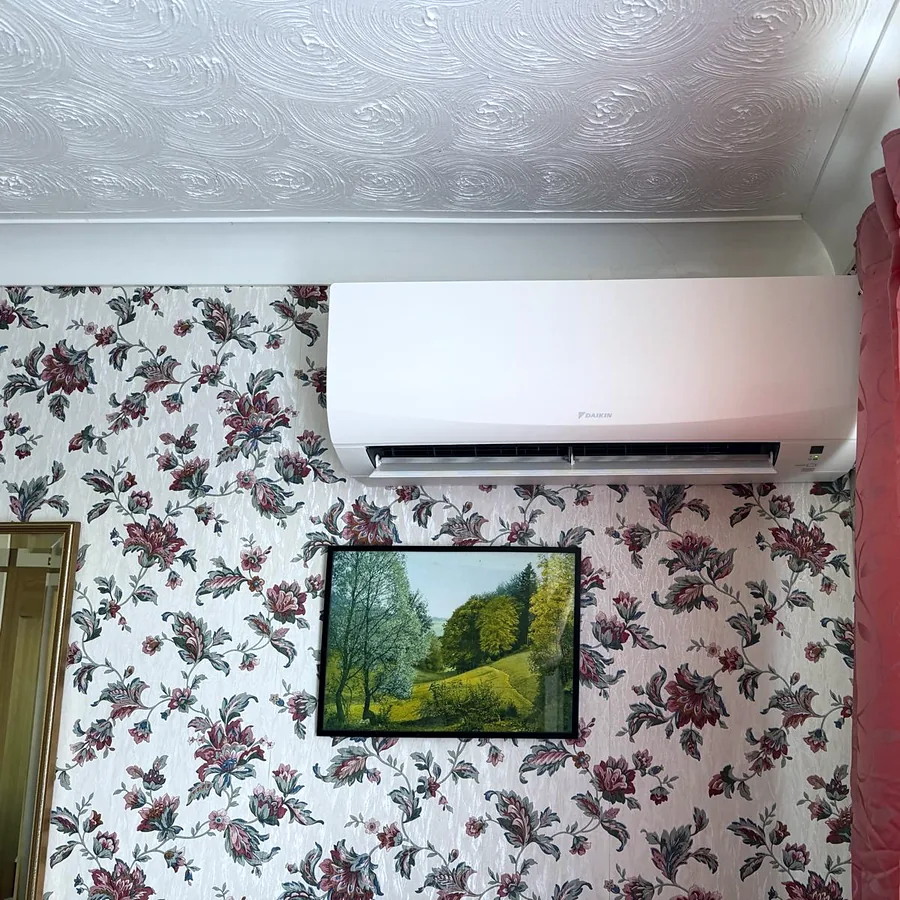 A Daikin wall unit we installed above a floral papered wall